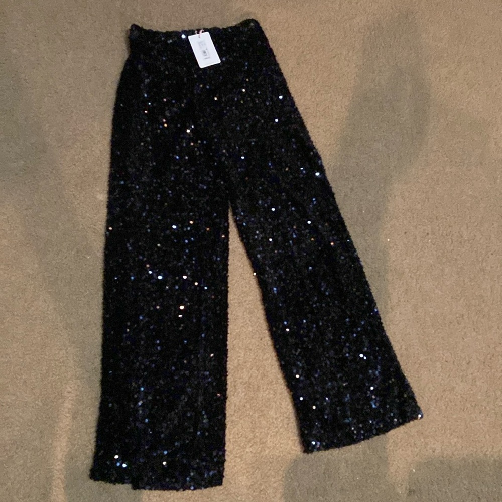 NWT women’s sequin pants 
Brand new size Sm ( approx 26 inch waist )